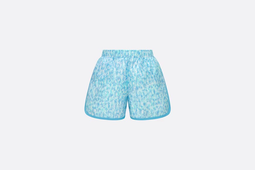 Children's swimmers.  Dip dyeing of printed scientific and technological fabrics with Dior Oblique in maze and ivory colors.  Numbering: 3WBM21SWMB_Y160