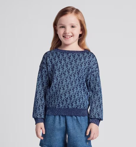 Children's sweater.  The color and color Dior Oblique flowers are mixed with the gold line.  Numbering: 3WBM14PULC_Y38I